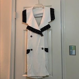 White and navy blue polka dotted romper.